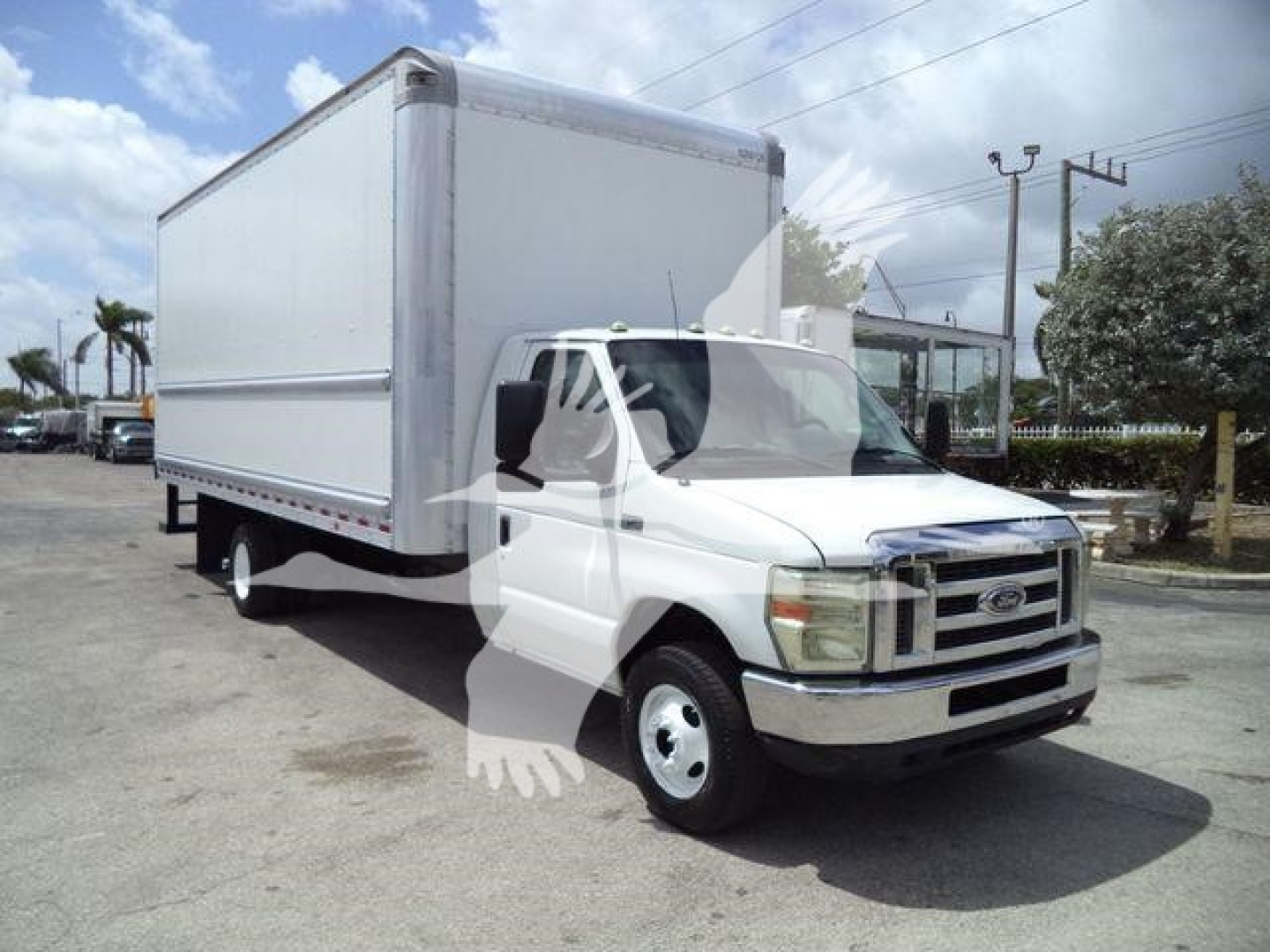 2011 Ford E450 box truck with large cargo box, white cab, front grille, and dual rear wheels. image shows no visible branding text or labels on the box.