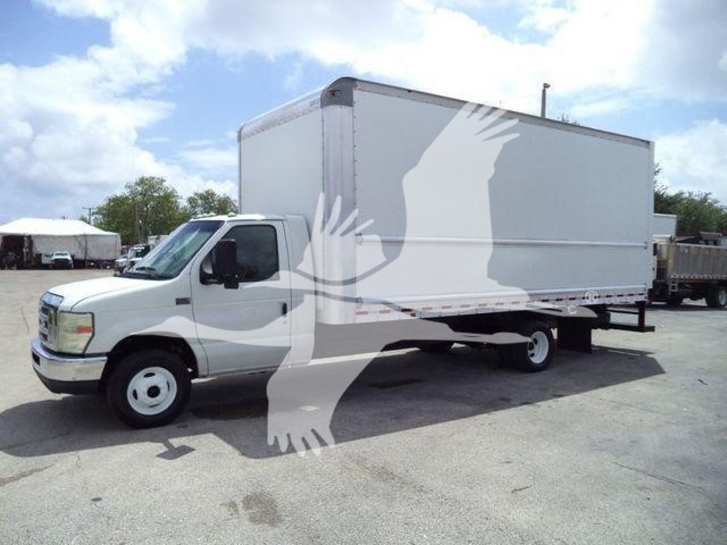Ford E450 box truck in service showing large white box body and cab withระ white birds watermark across image