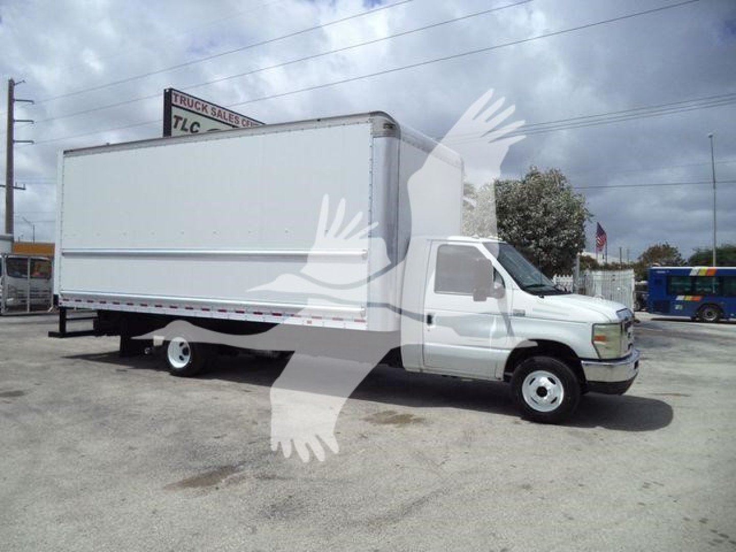 Ford E450 box truck in side view showing cargo box and cab with white exterior.