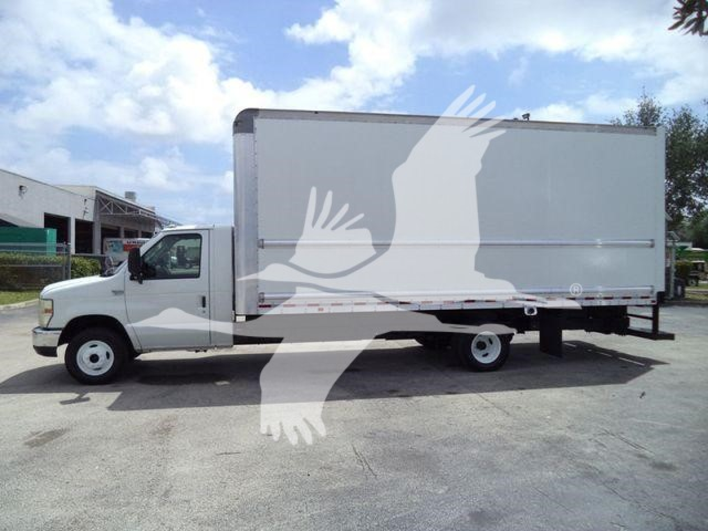 Ford E450 box truck side view showing cargo box and cab with stock number T02379FM.