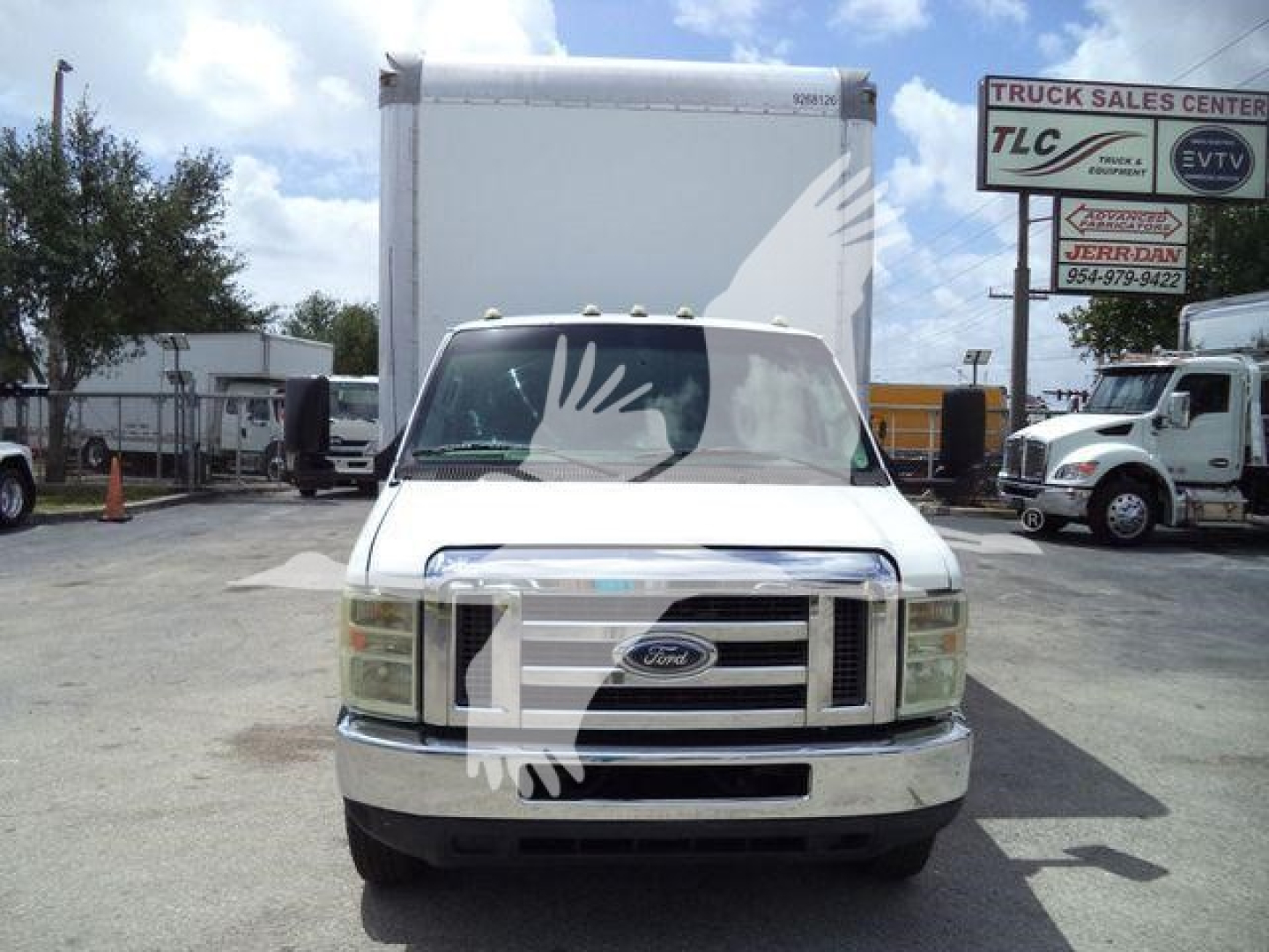 Ford E-450 box truck front view showing grille and headlights with box cargo in the background.