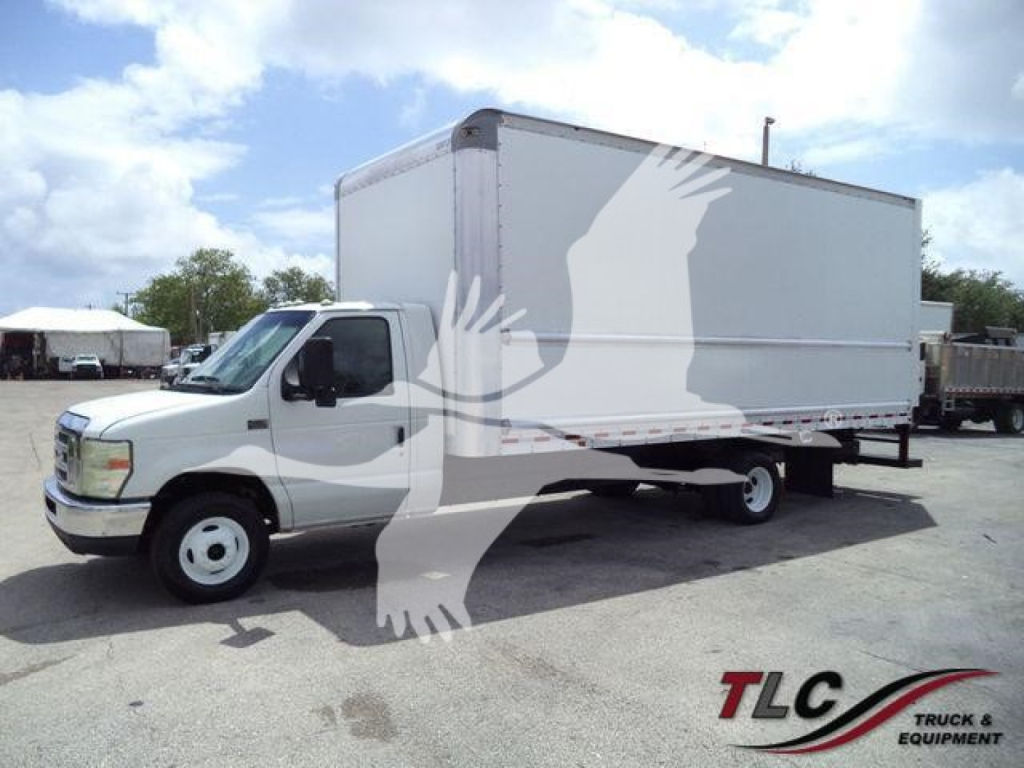 Box truck 2011 Ford E450 in-service with large white box body, cab logo, and rear wheel visible.