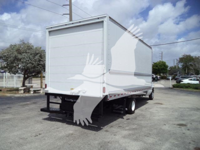 Box truck rear view showing cargo box and dual rear wheels on a Ford E450 chassis.