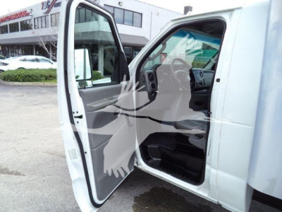 Ford E-450 cargo van interior with front passenger door open, showing steering wheel, dashboard, and grey door panel.