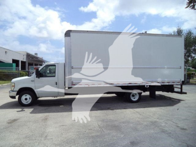 Ford E450 box truck side view showing cargo box and cab with stock number T02379FM.
