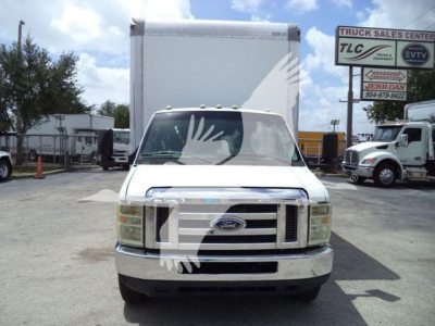 Ford E-450 box truck front view showing grille and headlights with box cargo in the background.