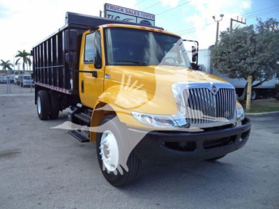 2019 International 4300 dump truck in yellow and black, front-right view, with black dump bed and chrome grille.