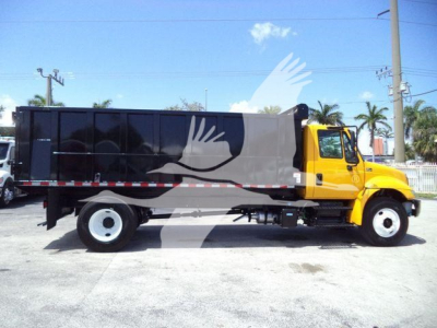 2019 International 4300 dump truck side view with yellow cab and black dump body.
