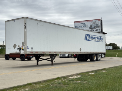 Trailer side view showing a white utility 4000Dx semi-trailer with River Valley Trailer Leasing logo, dual rear axles, and support legs.