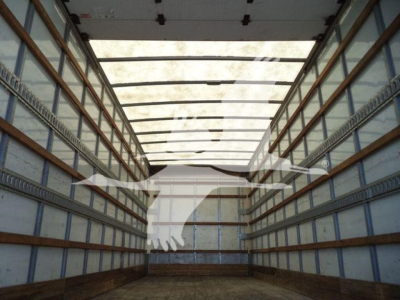 Trailer interior showing empty box truck cargo area with side rails and translucent roof panels.