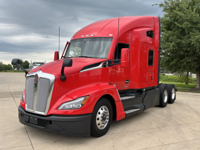 Kenworth T680 conventional sleeper truck in red, front-left view with chrome grille and dual rear axles.