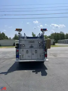 Back view of a Pierce Lance Pumper fire truck showing rear compartments and tail lights.