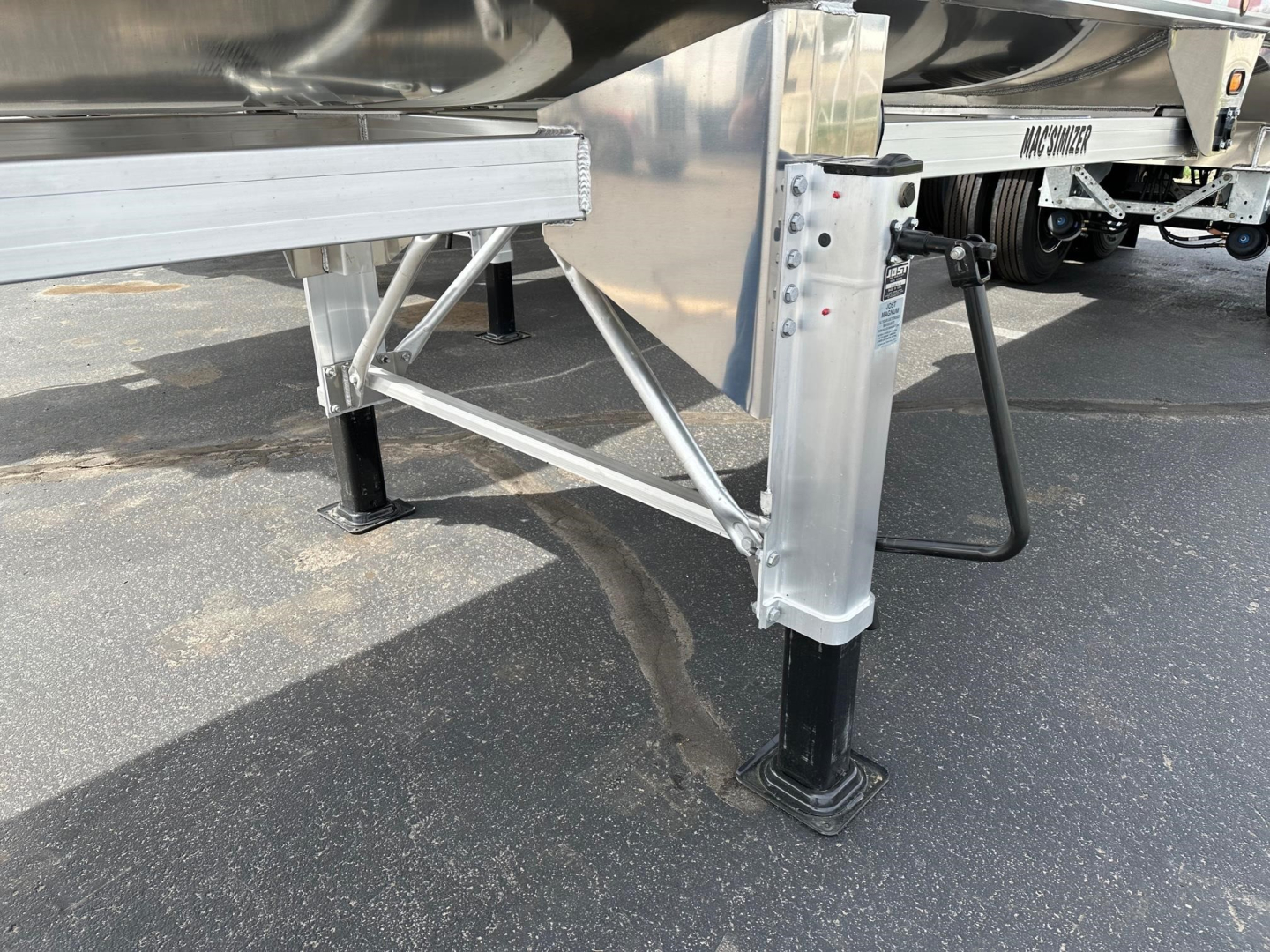 Mac Macsimiser trailer landing gear and frame showing leg with black foot pad and silver support hardware.