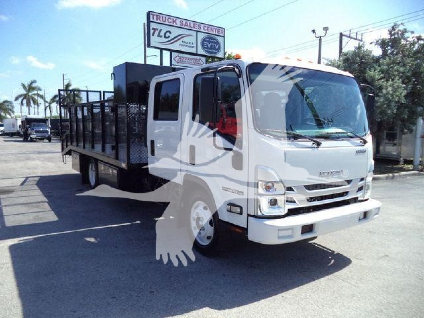 Isuzu NPR-HD truck with flatbed utility bed, front view, showing cab and large windshield.