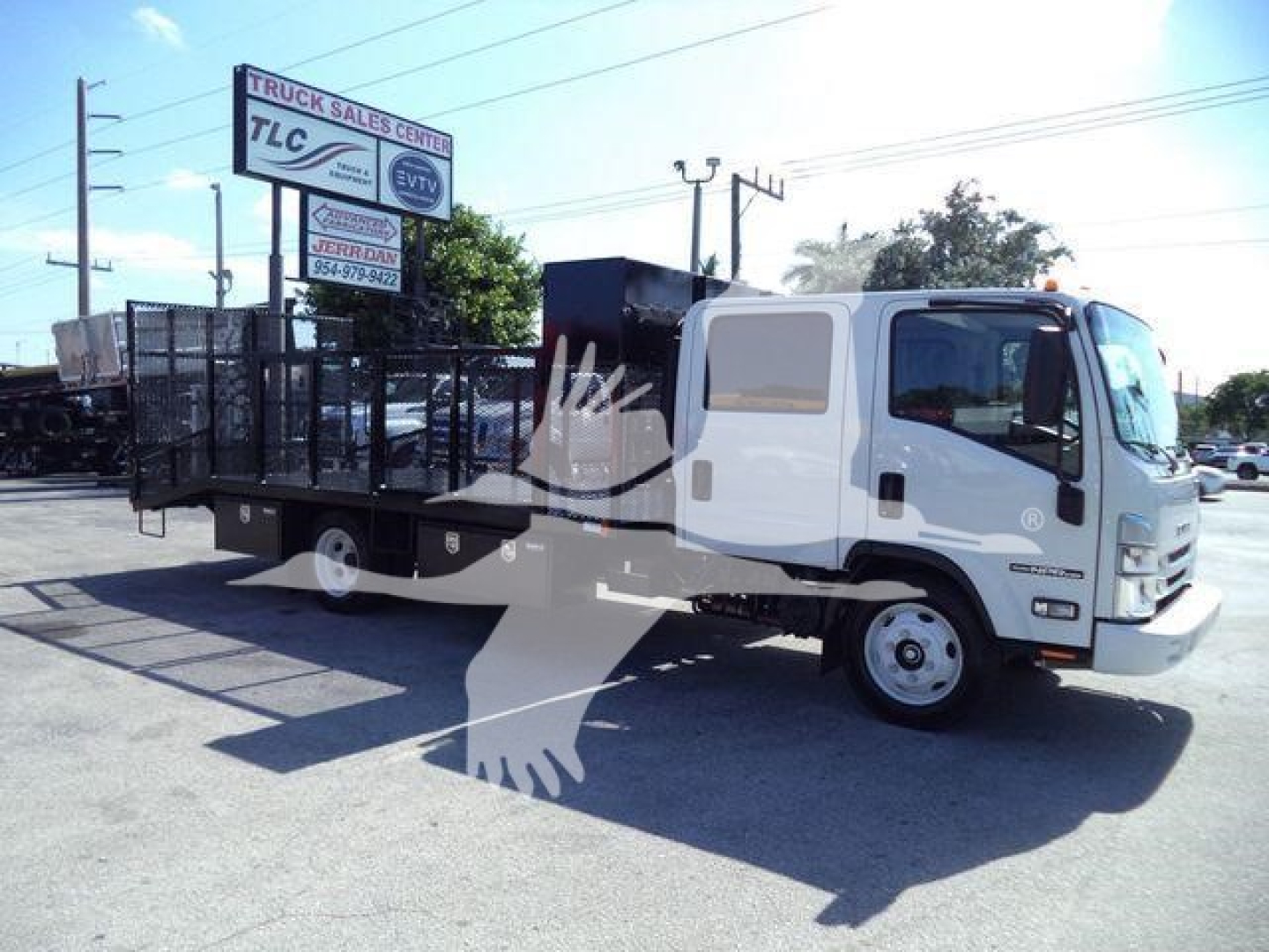 Isuzu NPR-HD truck with flatbed and side cab view showing landscape work truck