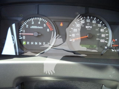Isuzu NPR dashboard showing tachometer up to 6 x1000 rpm and speedometer up to 100 mph, with gear indicator PRND and warning lights.