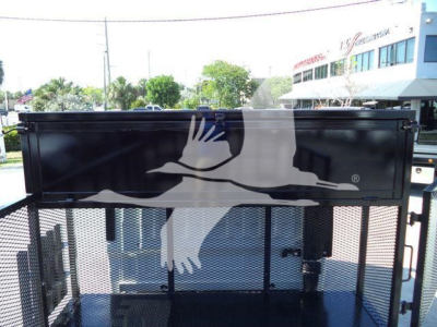Isuzu NPR-HD truck bed side panel showing a graphic of flying birds and a winged logo.
