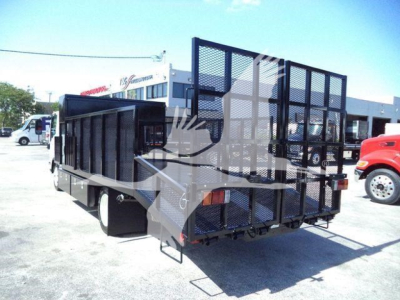 Isuzu NPR-HD landscape truck bed trailer with tall mesh sides and rear ramp, viewed from rear-left angle, stock number NPRLANDSCAP.