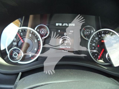 Ram 1500/5500 dashboard cluster with gauges and center digital display showing coolant temp, RPM, and speedometer; Ram logo at top.