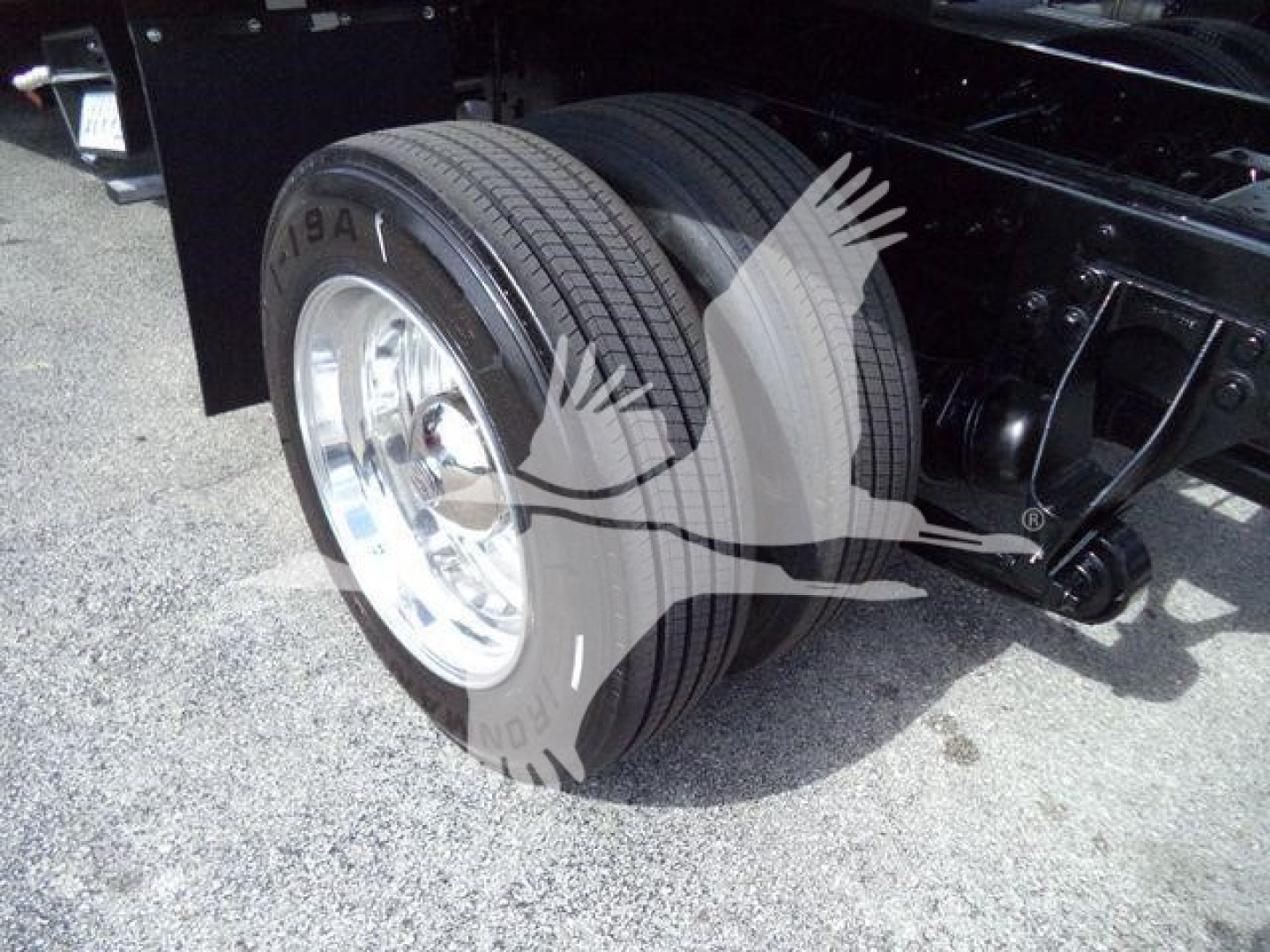 Dual rear wheels on a 2019 International 4300 truck showing tire and suspension components.