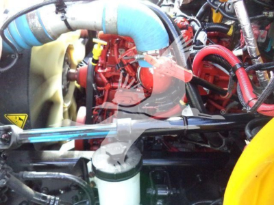 2019 International 4300 engine bay showing cooling system hoses and air intake components.