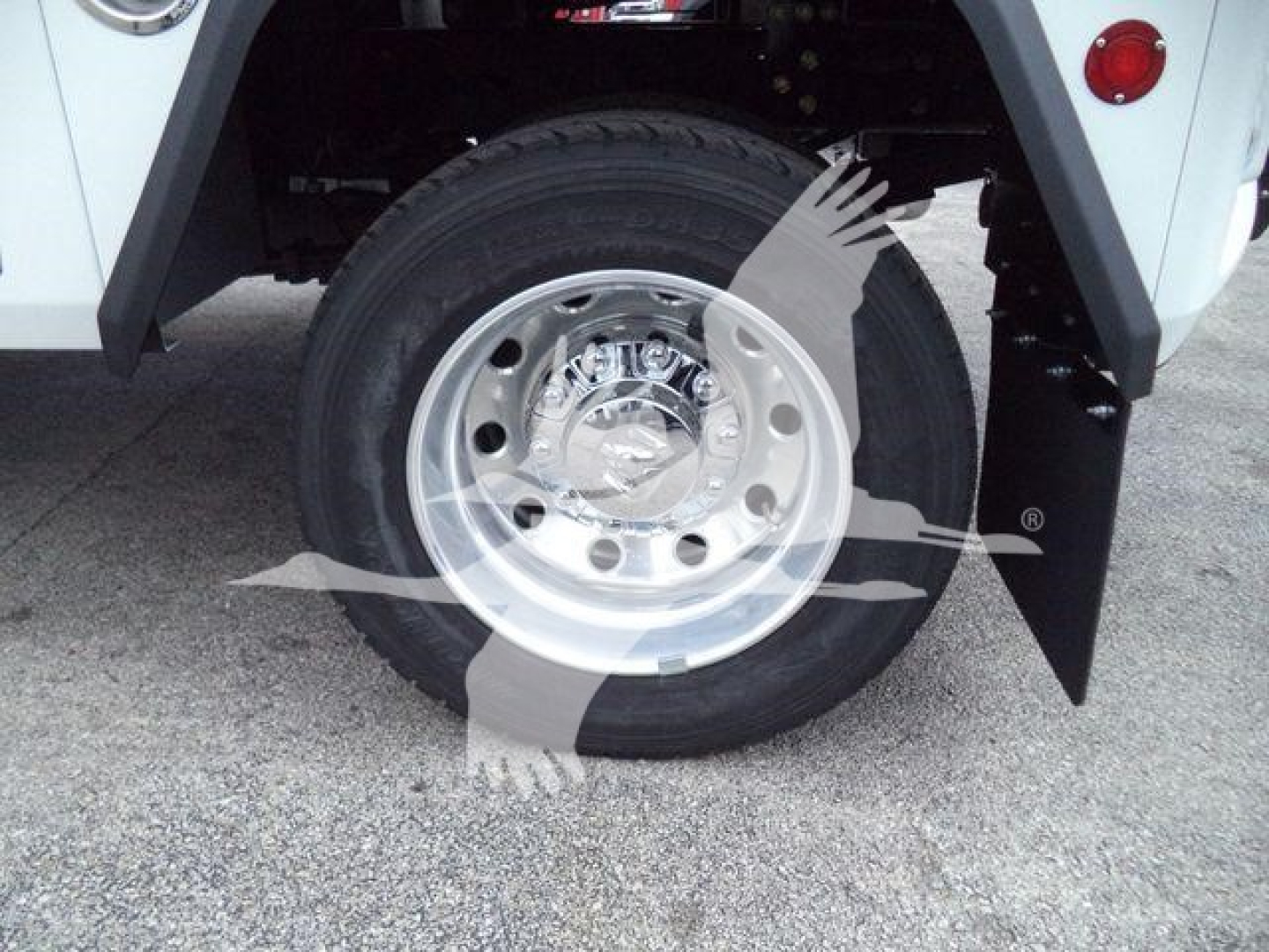 Truck wheel and tire visible on front fender with chrome hub and black tire, part of Ram 4500 SLT winch-equipped chassis.
