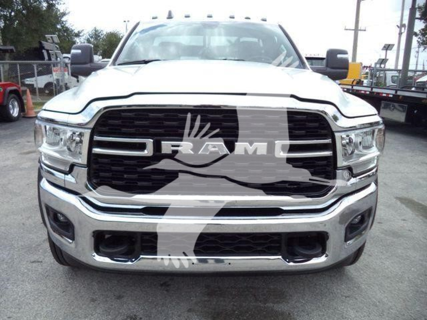 Ram front grille showing RAM emblem and chrome bumper in a 2024 Ram 4500 SLT truck.