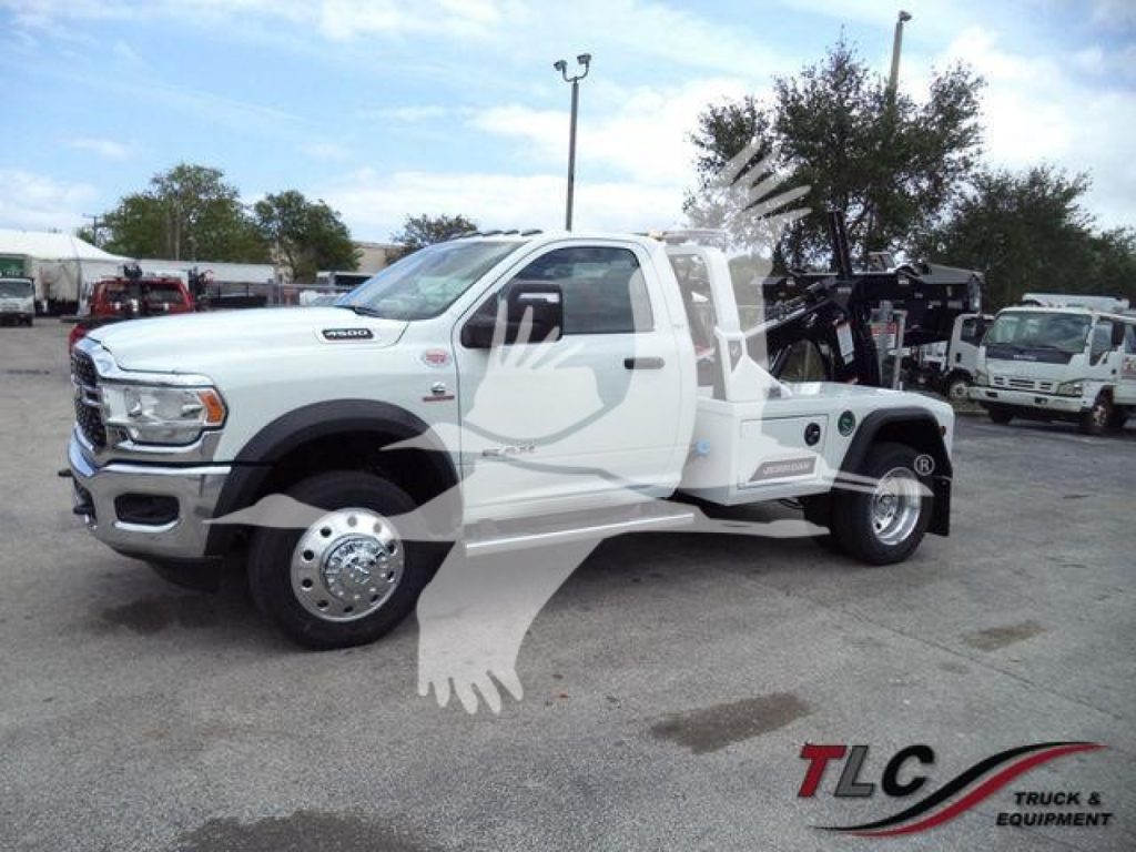 Ram 4500 tow truck rear-view showing winch equipment and dual rear wheels with white cab