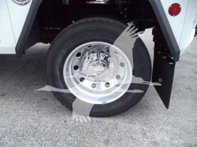 Truck wheel and tire visible on front fender with chrome hub and black tire, part of Ram 4500 SLT winch-equipped chassis.