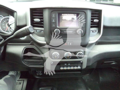 Ram 4500 dashboard and center console view showing infotainment screen, climate controls, and gear area.