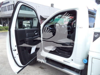 Ram 4500 SLT truck interior and cab access with driver door open, showing black interior trim and dashboard from outside the cab.