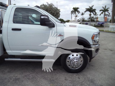 Truck side profile showing a white 2024 Ram 4500 SLT with Winch category signage, large chrome wheel, and side step; stock number J98304FM visible.
