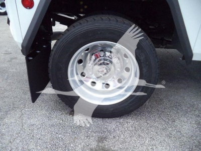 Wheel and tire of a Ram 4500 SLT front with polished aluminum rim and black tire under fender, part of winch-equipped truck.
