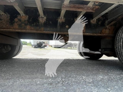 Underbody view of a Transcraft DTL-2000 trailer showing rusted frame and wheels.