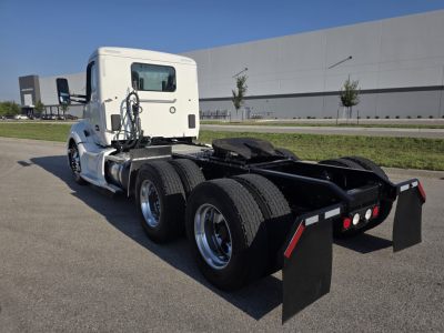 Kenworth T680 rear/side view showing dual rear axles and fifth wheel, with no text visible on the image itself.