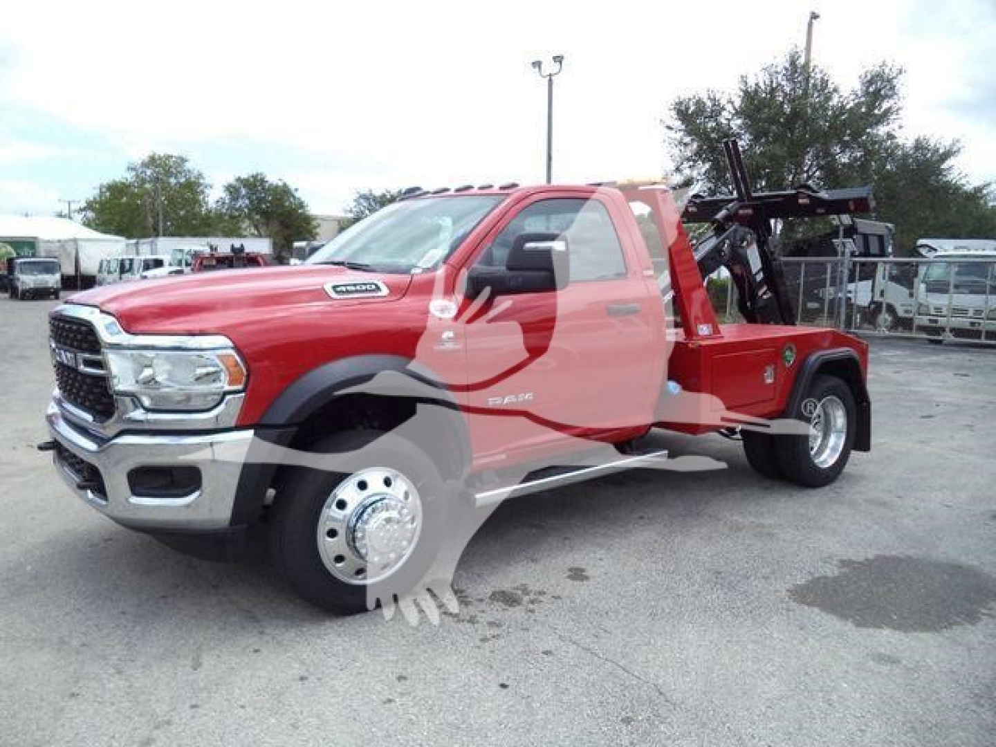 Ram 4500 SLT tow truck in red with aftermarket winch setup and dual wheels, side view