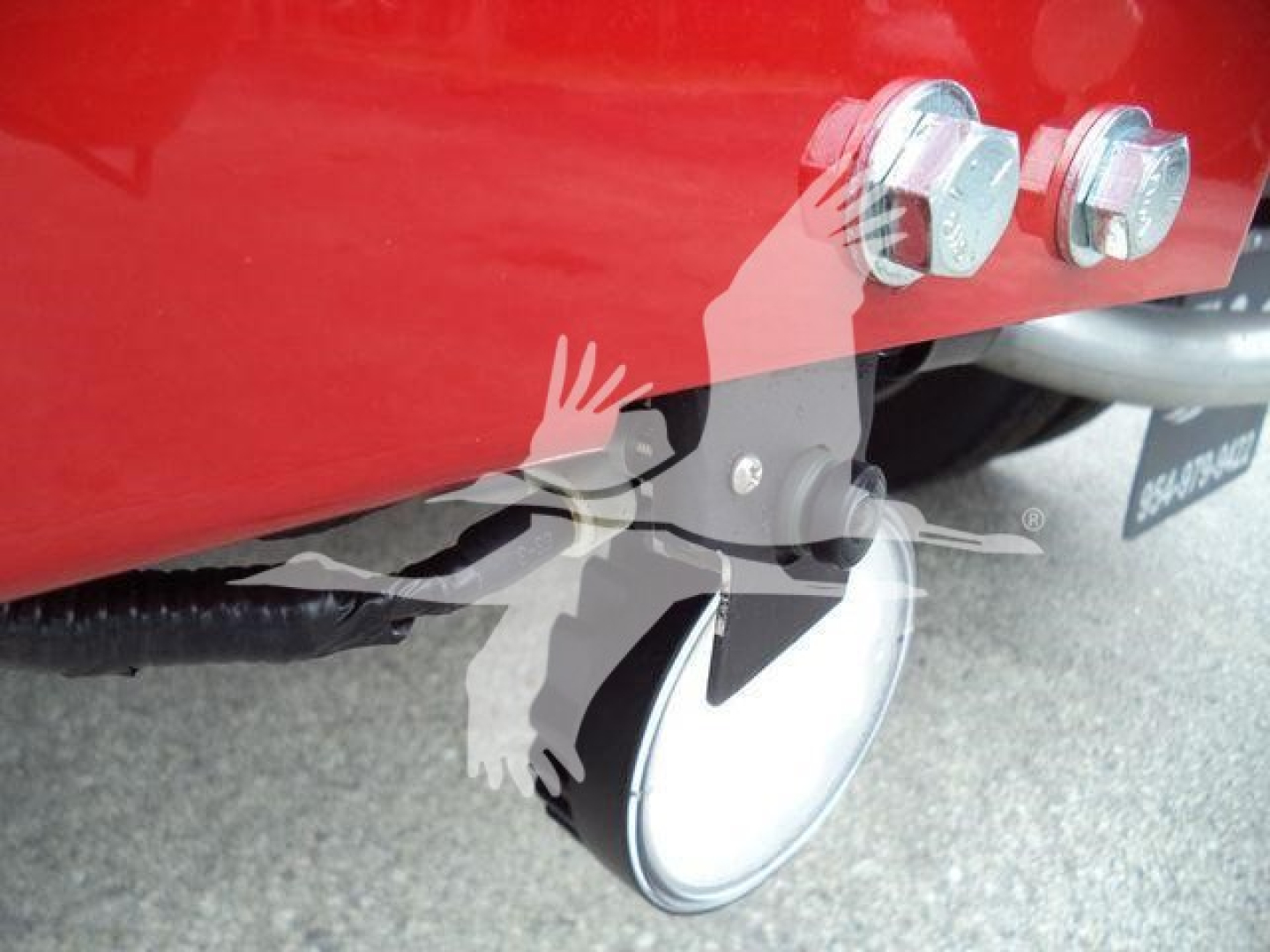Truck winch area showing bumper bolts and winch mounting; nozzle and wiring harness visible.