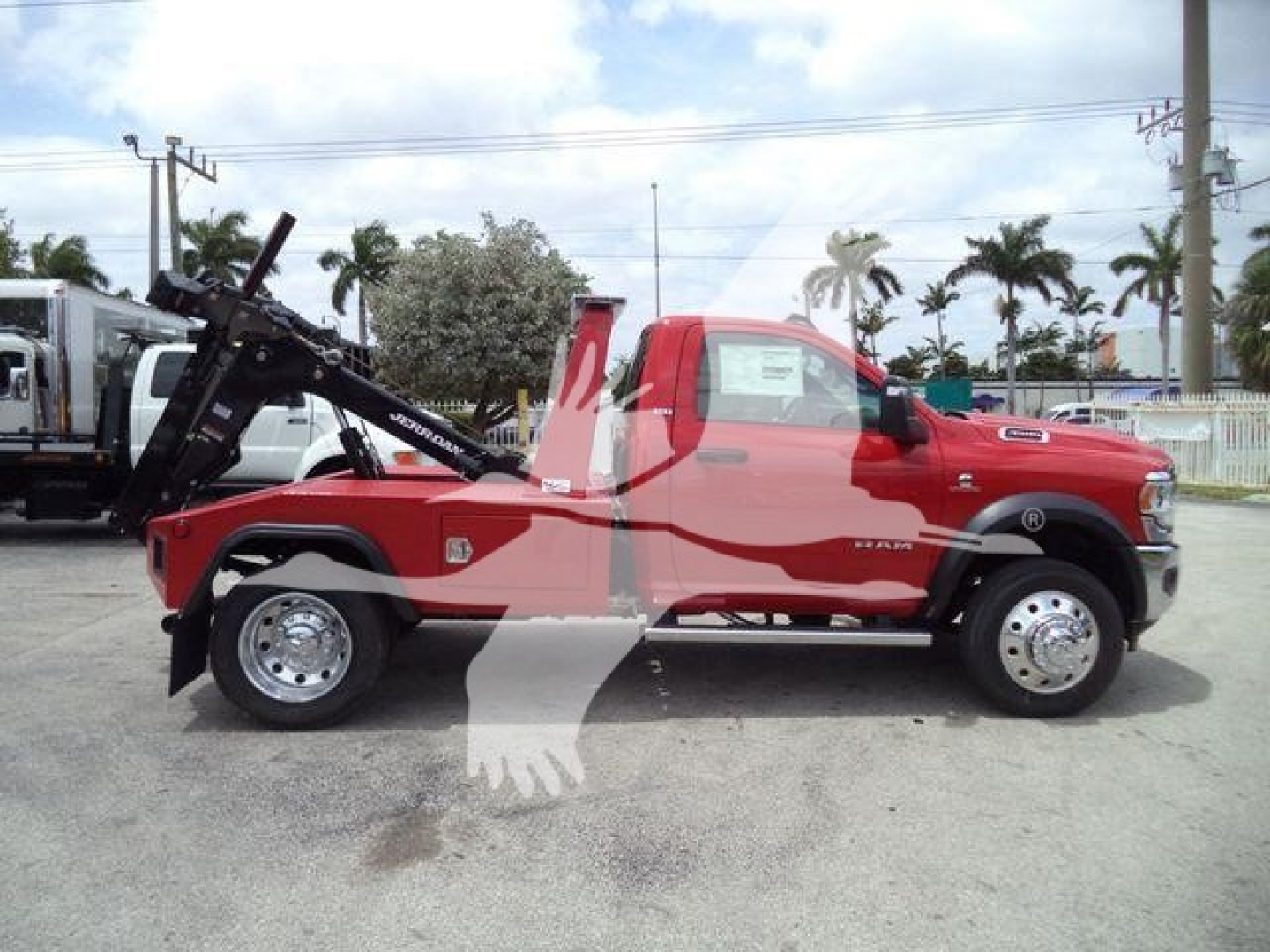 Ram 4500 tow truck with winch in open lot showing side profile and equipment