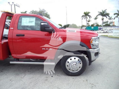 2024 Ram 4500 SLT side view showing red pickup truck with winch category label and stock number sticker on the window