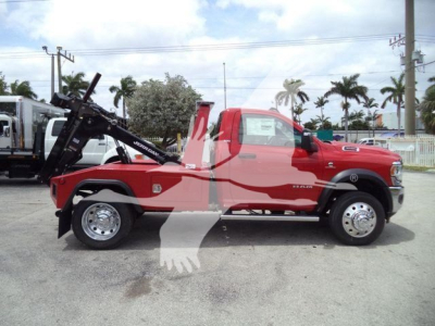 Ram 4500 tow truck with winch in open lot showing side profile and equipment