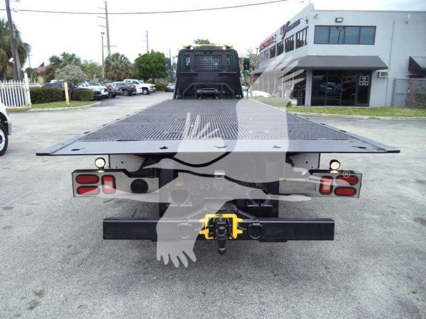 Peterbilt 348 rollback flatbed truck rear view showing hitch and taillights