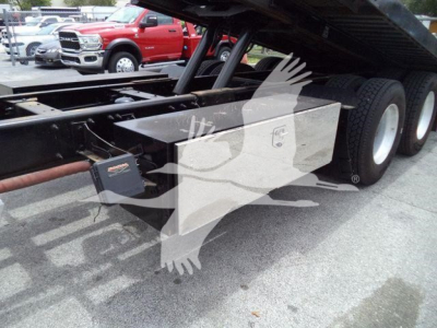 Truck chassis showing toolbox and dual rear wheels of a 2016 Peterbilt 348 rollback truck.