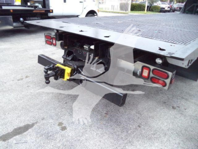 Peterbilt 348 rollback bed rear view showing tow hitch and bumper lights.
