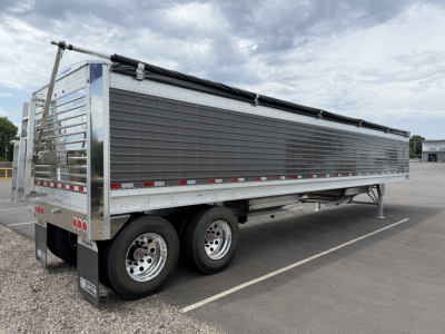 Stoughton 40' aluminum grain hopper trailer with 68-inch corrugated sidewalls, dual rear axles, tarp cover, metallic panel sides, VIN 1DW1G4022VSC27918.