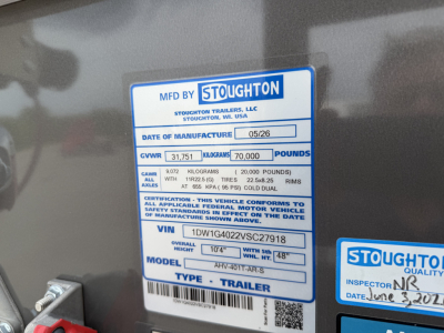 Stoughton trailer manufacturer plate on grain hopper showing MFD BY STOUGHTON with date 05/26, GVWR 31,751 kg (70,000 lb), VIN 1DW1G4022VSC27918, model ARV-4011-AR, type trailer.