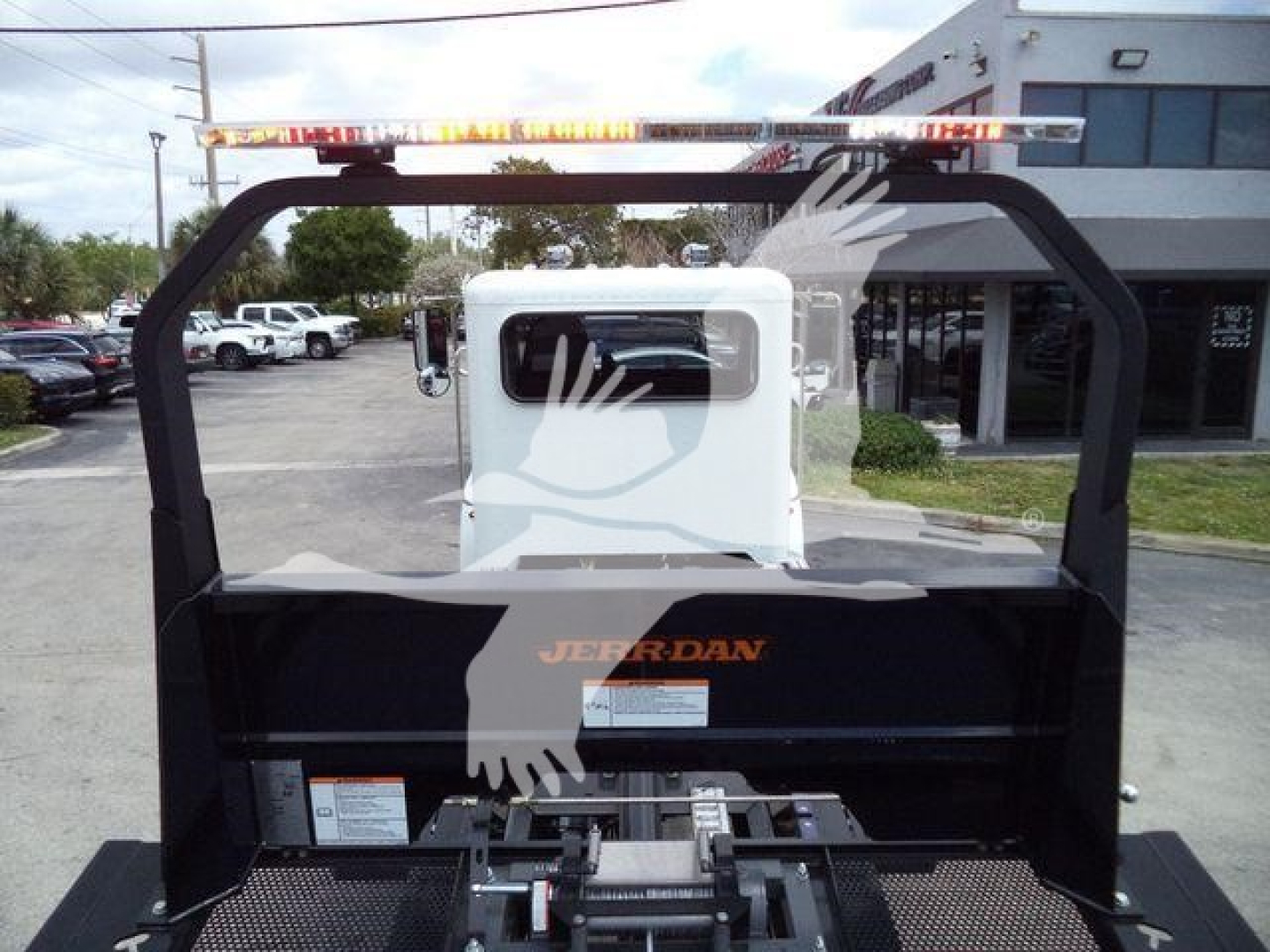 2018 Peterbilt 337 rollback truck attachment with rear cab and metal frame visible