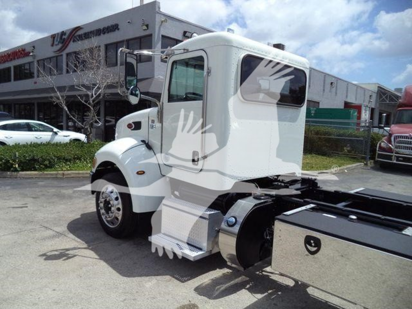 Peterbilt 337 cab and rollback chassis side view, white exterior, stock number T52290FM visible.