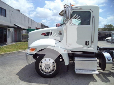 Peterbilt 337 cab in white, side view showing front wheel, fuel step, and side mirror.