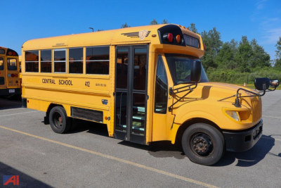 School bus side view showing Central School text and bus number 412, open door, yellow IC Corporation AE Series mid-size school bus.