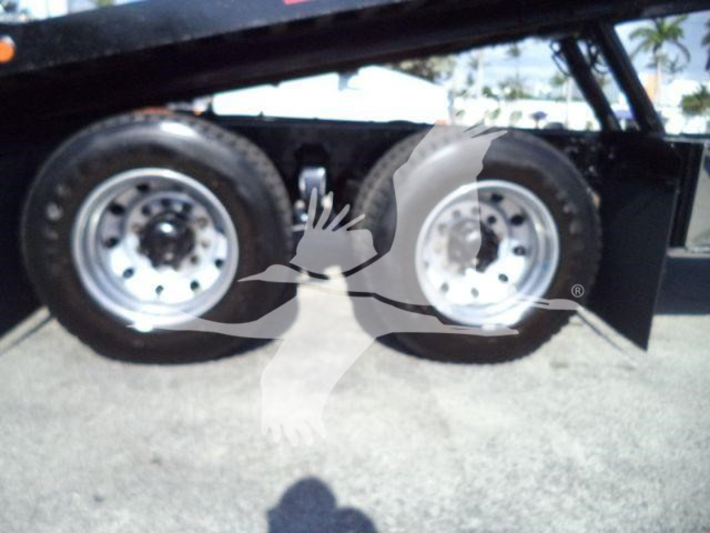 Freightliner M2 106 rollback truck wheel wells and dual rear tires visible underbed with metal fender.